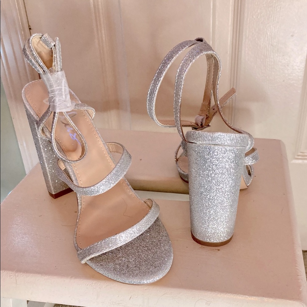 NWOT Sparkly silver strappy heels.
